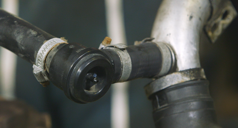 The bypass valve is opened via a vacuum line that comes from the intake manifold. When you close the throttle, the intake manifold pressure changes, opening the bypass valve. Its job is to prevent high pressure spikes in the intake system from causing “surging,” which results in turbo lag. Photo: Jared Auslander